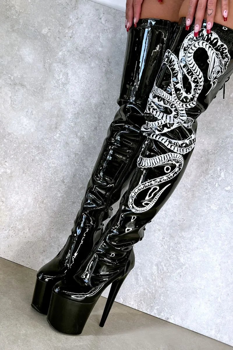 Sure! Heres an optimized title for the e-commerce product:

**Hella Heels Thicc Thigh-High 8-Inch Black and White Snake Print Boots**