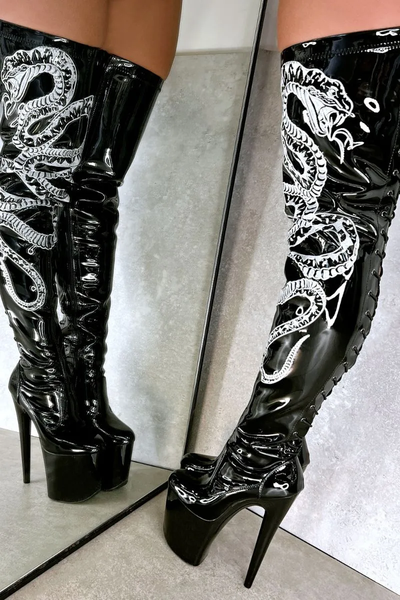 Sure! Heres an optimized title for the e-commerce product:

**Hella Heels Thicc Thigh-High 8-Inch Black and White Snake Print Boots**